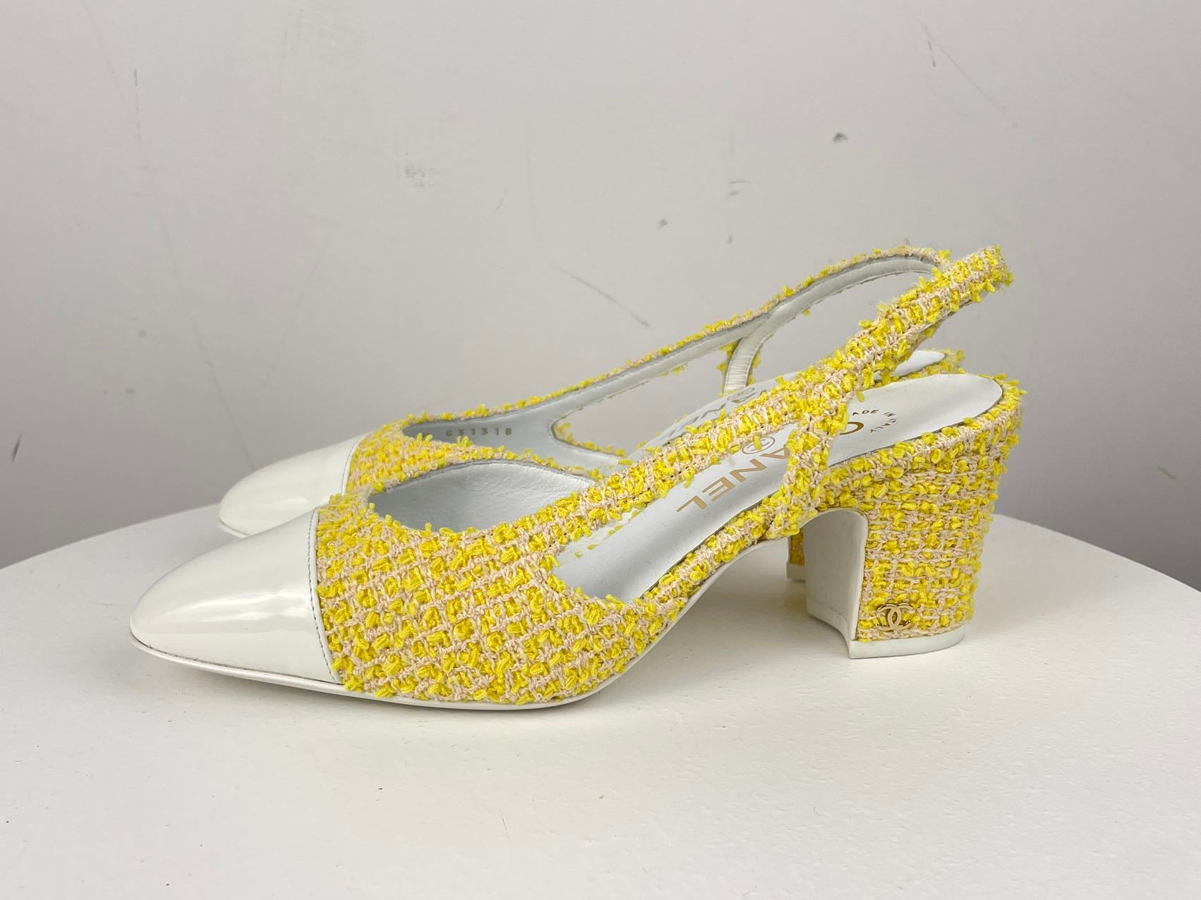 Used Chanel light yellow tweed slingback pumps with CC logo