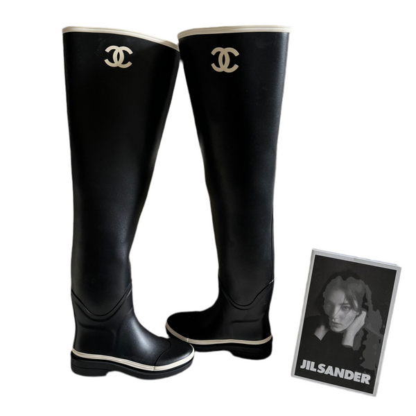 Used Chanel rubber over the knee boots in black and white Used Chanel rubber over the knee boots in black and white