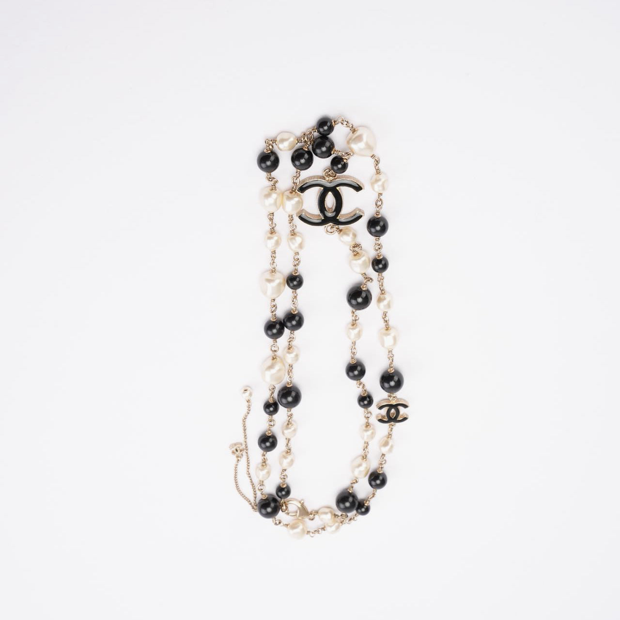 Used Chanel CC Long Necklace with Black Beads and Faux Pearls
