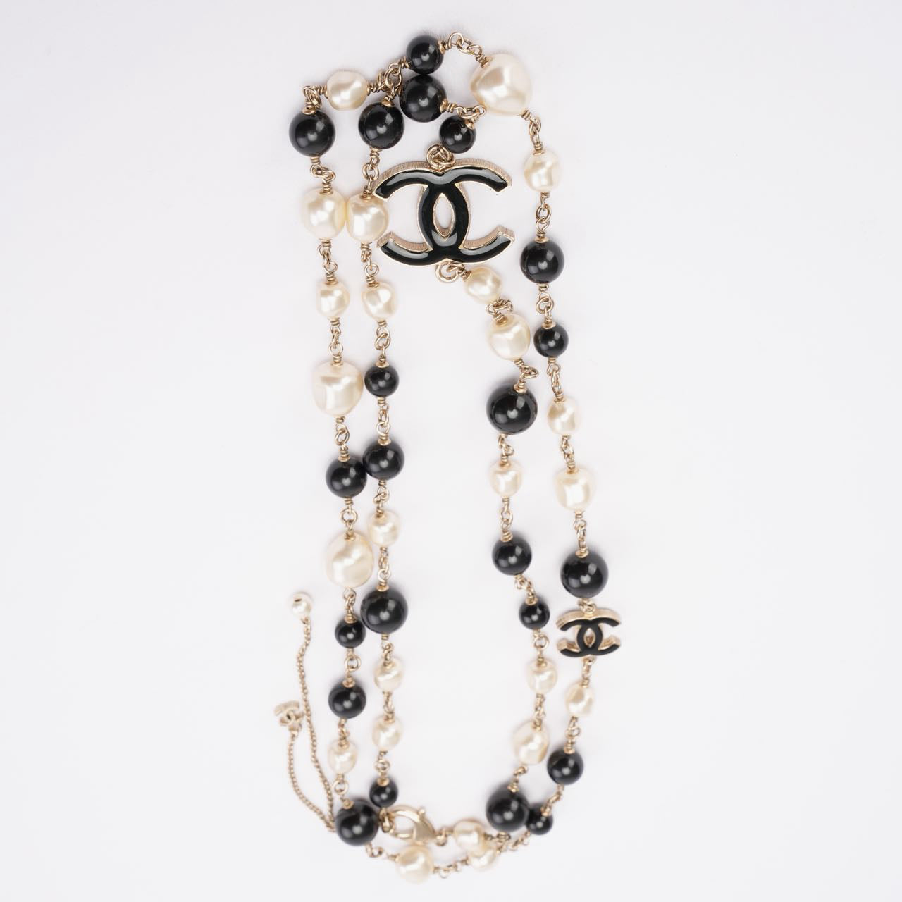 Used Chanel CC Long Necklace with Black Beads and Faux Pearls